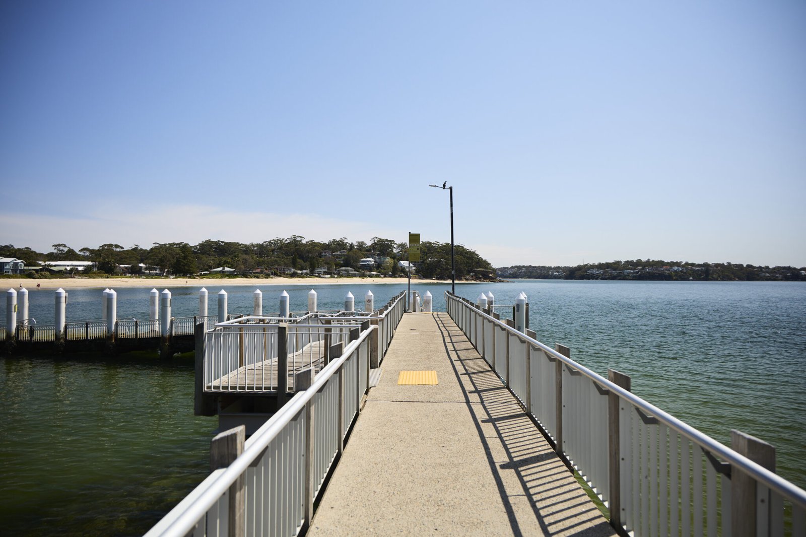 Wooden boardwalk leading across water in Royal National Park