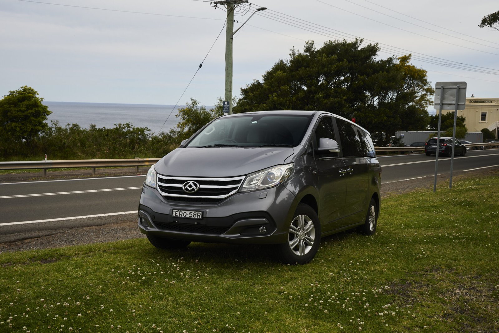 Car driving through Royal National Park along scenic road